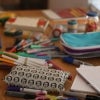 Pencils, markers and other writing utensils on a desk