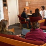 a small group discusses their writing goals